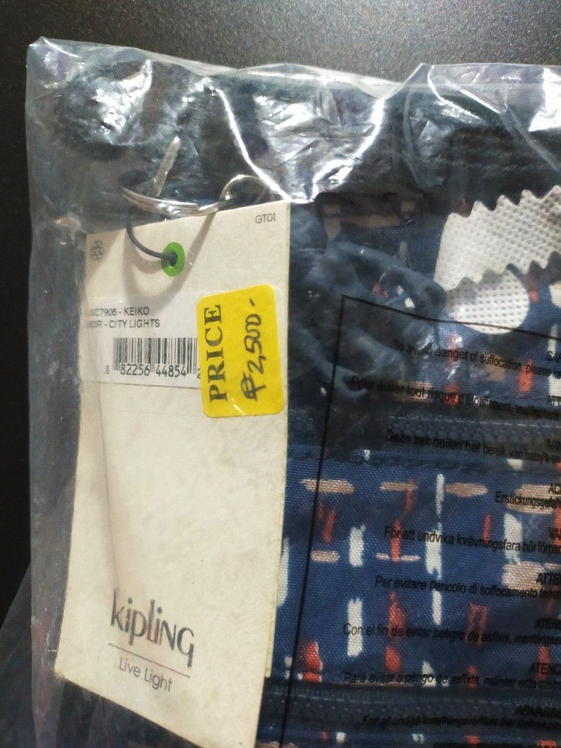 Kipling Keiko City Lights Navy Patterned Crossbody Bag (Category: Cross-body Bags) located in Tanza. Submitted by lessmess.ph (Listing ID 1281984522, Image 3). Description: Kipling Keiko City Lights Navy Patterned Crossbody Bag • Received as a gift but never used • Still in the original packaging, with tag and keychain • Has three zipper compartments • Approx. 8.5in x 9.5in MOP: GCash and Maya MOD: LBC or Lalamove.