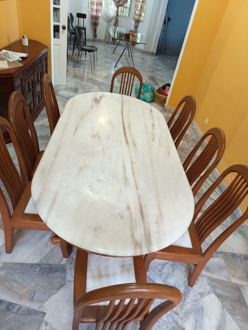 Marble table (Category: Tables & Sets) located in Kuala Lumpur. Submitted by monkeynuts (Listing ID 1281844157, Image 3). Description: 8 seater marble dining or meeting table. Tabletop could use sanding and refinishing. One of the chairs has a crack that can be repaired..