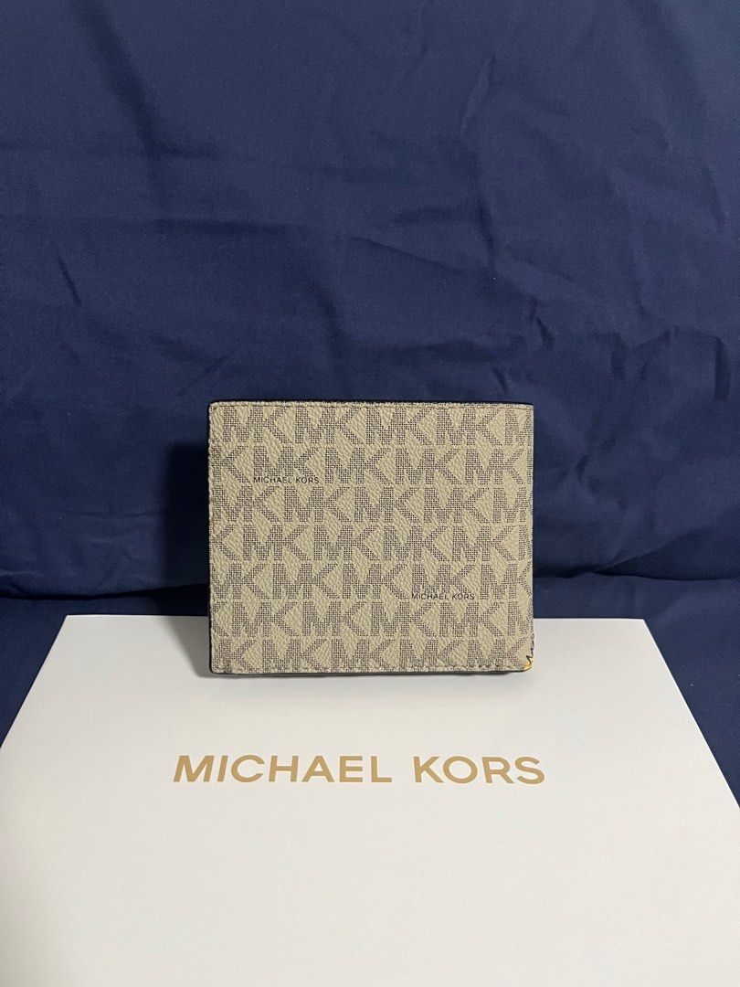 Michael Kors MK Unisex Bifold Wallet (Category: Wallets & Card holders) located in Rizal. Submitted by pieces_mnl (Listing ID 1281980852, Image 2). Description: o- Brand New - With Original Price Tag - With Gift Receipt for proof of authenticity - Included Michael Kors Box Shipping shouldered by Buyer.