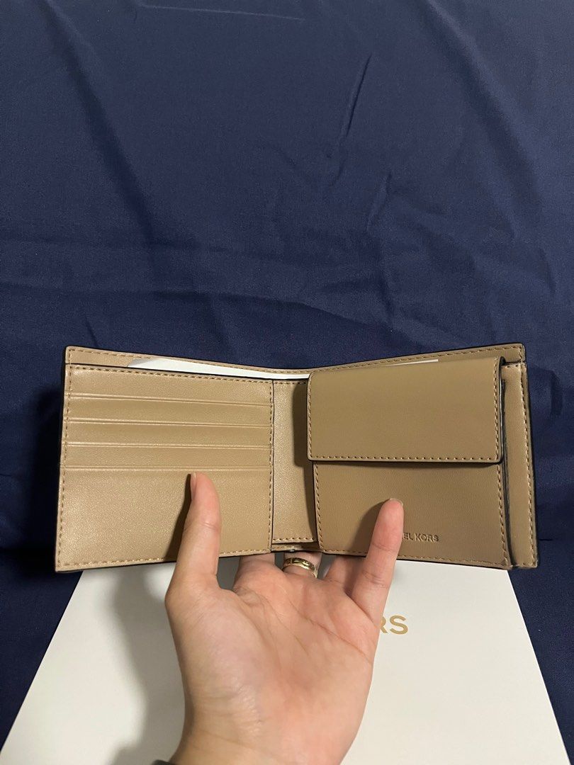 Michael Kors MK Unisex Bifold Wallet (Category: Wallets & Card holders) located in Rizal. Submitted by pieces_mnl (Listing ID 1281980852, Image 3). Description: o- Brand New - With Original Price Tag - With Gift Receipt for proof of authenticity - Included Michael Kors Box Shipping shouldered by Buyer.