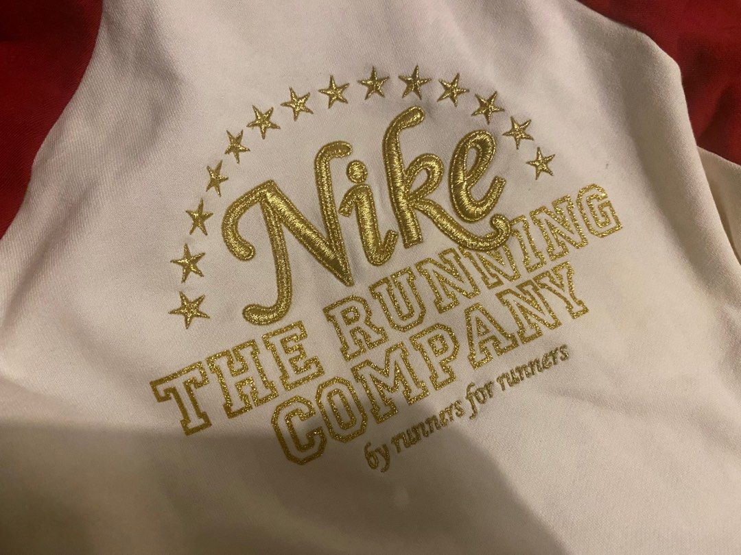White nike windbreaker new arrivals with gold logo