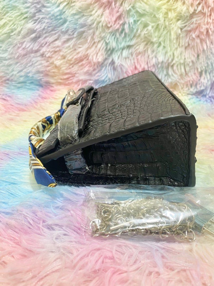 Mini Kelly Genuine Crocodile Leather (Category: Luxury Bags & Wallets) located in Makati City. Submitted by secondlyf (Listing ID 1282181128, Image 3). Description: For you exotic leather lovers out there! Discover our Mini Kelly, a beautifully crafted bag in genuine crocodile skin. Its design is sleek and logo-free, accompanied by a complimentary silver chain sling that transitions effortlessly from day to night. This bag exudes elegance in a su