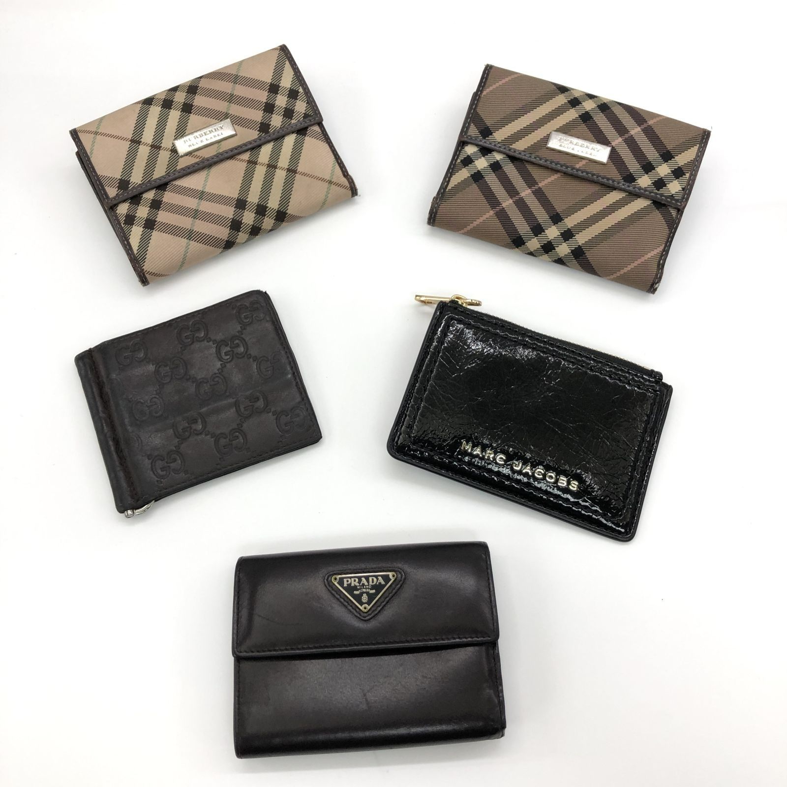 Burberry wallet vs prada shop