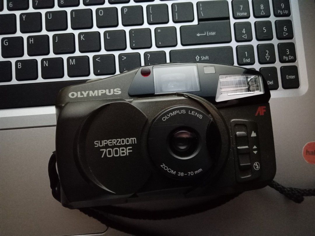 Olympus Superzoom 700BF (Category: Cameras) located in Manila. Submitted by squeedler (Listing ID 1282109865, Image 2). Description: needs repairing!! it still works, but it randomly turns off sometimes. flash working. 10 sec. timer working. haven't tested it with 35mm film. battery: 2 AA batteries (not included) inclusions: camera pouch camera buy at your own risk no return/refund will post more pics later!!.