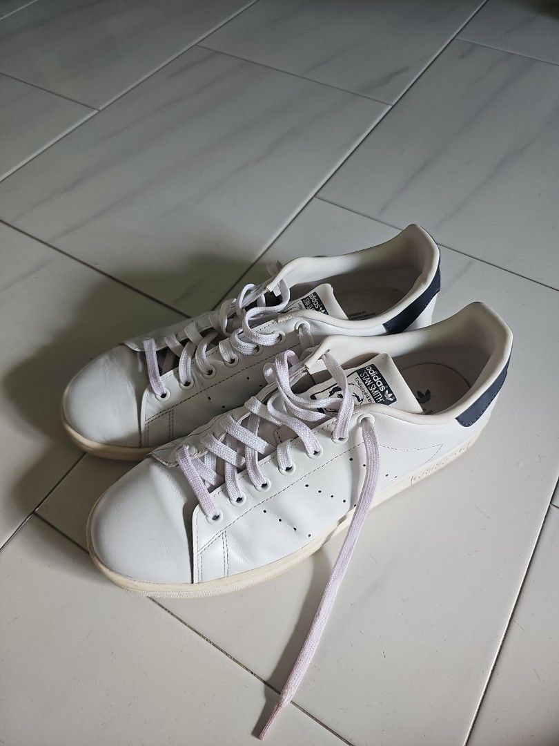 White sneakers with cheap blue stripes