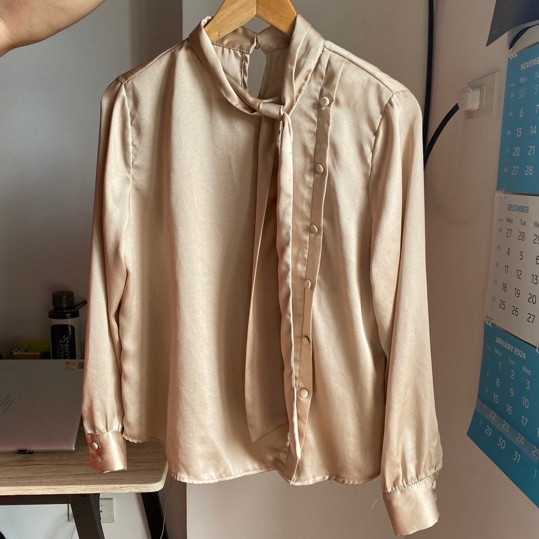 Beige Satin/Silk Longsleeves with Ribbon (Category: Longsleeves) located in Manila. Submitted by bdgdeclutters (Listing ID 1282298756, Image 1). Description: Fits small to medium frames Perfect for office or formal occasions .