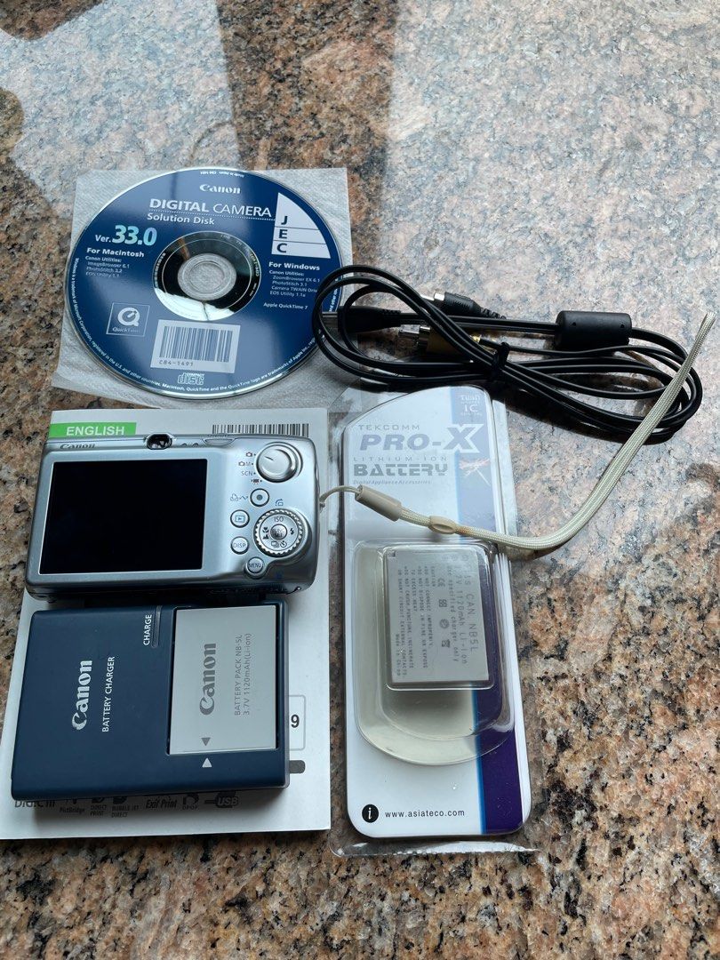 Appareil Photo Canon PowerShot IXUS 970 IS - Compact Argenté Avec Accessoires, Occasion