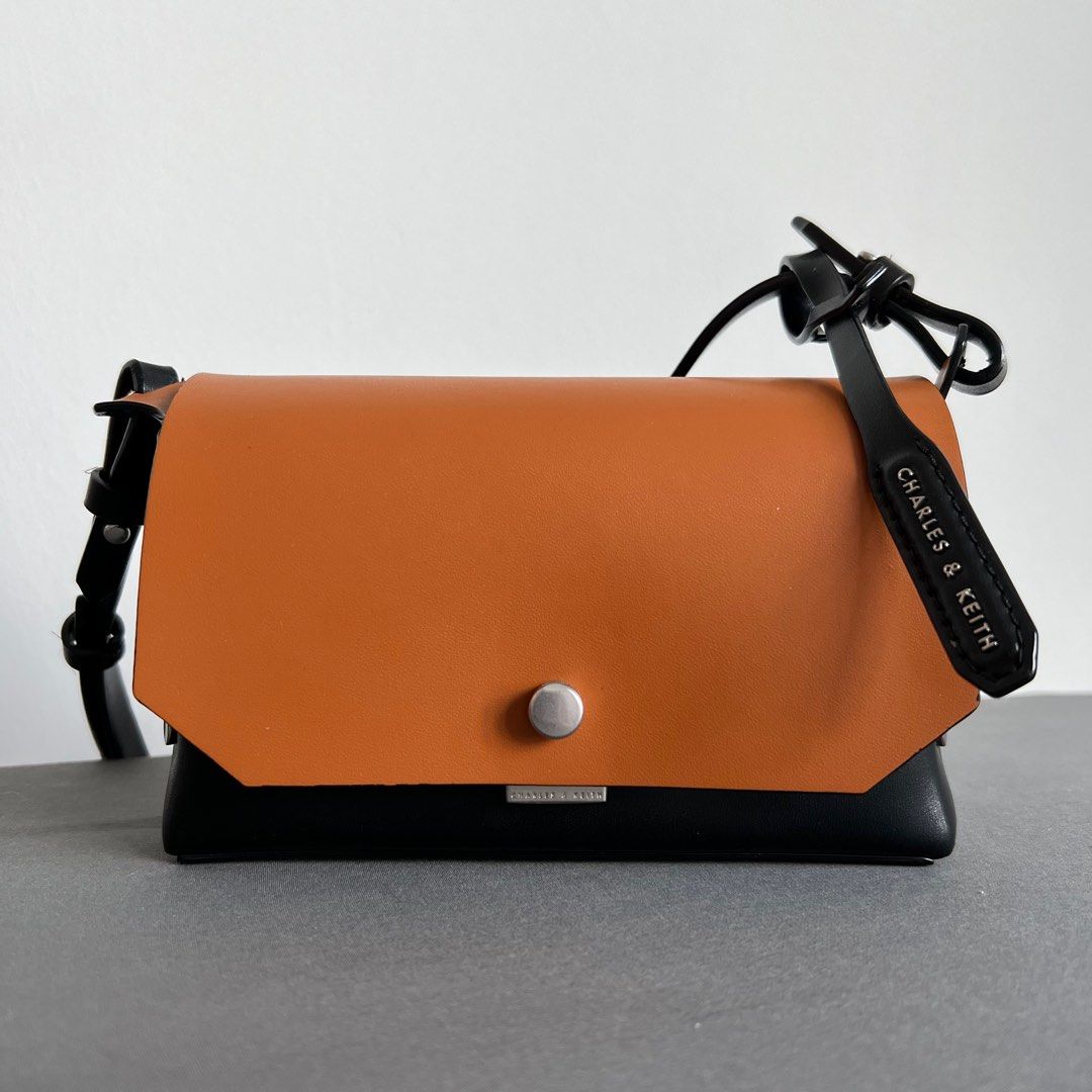 Mini reversible front store flap crossbody bag