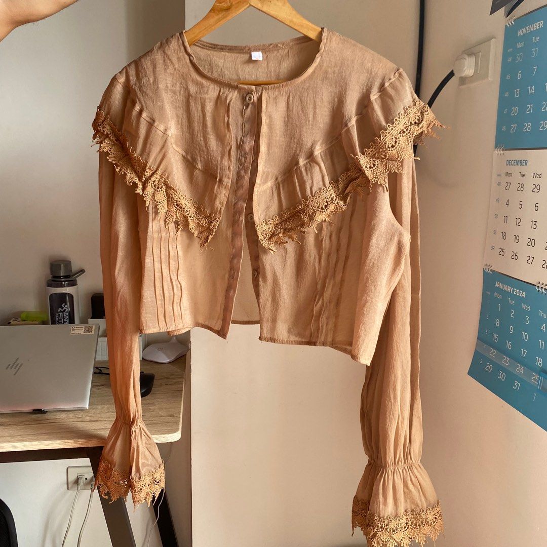 Light Brown/Beige Sheer Button-down Longsleeves with Lace (Category: Longsleeves) located in Manila. Submitted by bdgdeclutters (Listing ID 1282300277, Image 1). Description: Fits small to medium frames .