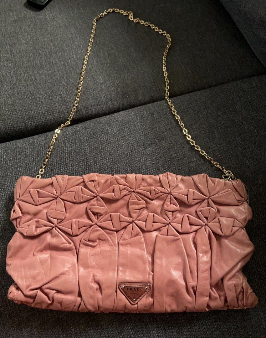 Prada Ruched clutch (Category: Luxury Bags & Wallets) located in Santa Rosa. Submitted by lbx89 (Listing ID 1282191878, Image 2). Description: Guaranteed authentic super nice pa you can add insert and chain for crossbody/sling.