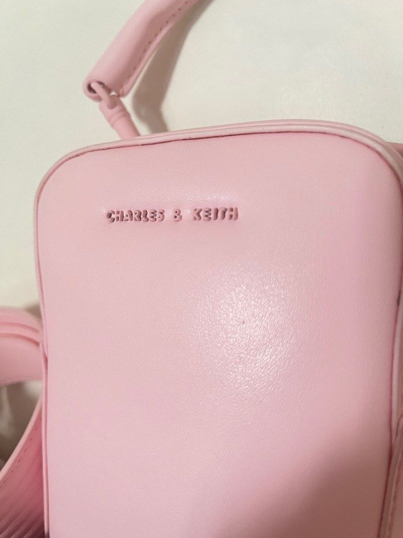 Charles & Keith - Pink cute body bag (Category: Cross-body Bags) located in Manila. Submitted by nabionly (Listing ID 1282415815, Image 2). Description: Used once (during coldplay concert only) Bought last January 18 for 3,799 at their Physical Store Rfs: Decluttering MOP: Gcash/Maya only MOD: Lalamove/LBC.
