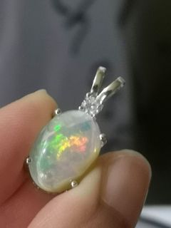 Flashy Ethiopian opal pendant in silver setting