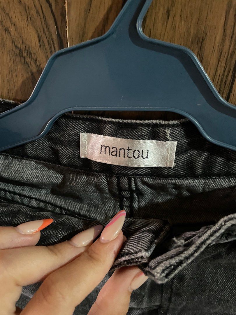 Mantou black denim skirt (Category: Skirts) located in Antipolo. Submitted by straub (Listing ID 1282425975, Image 2). Description: With flaw: missing button Size M on tag fits up to waist 27.