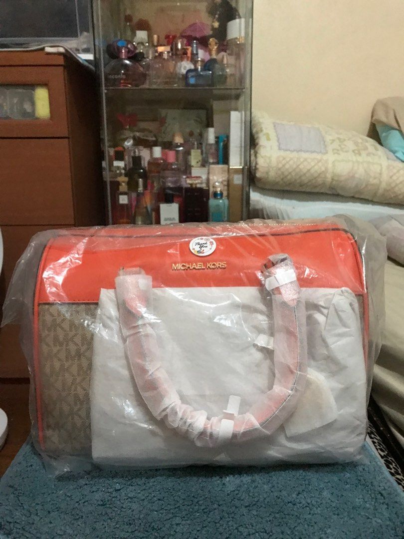 Mk duffle bag from US authentic (Category: Luxury Bags & Wallets) located in Quezon City. Submitted by tesspascual (Listing ID 1282400237, Image 3). Description: Mk duffle bag with sling strap , with paper bag from US .