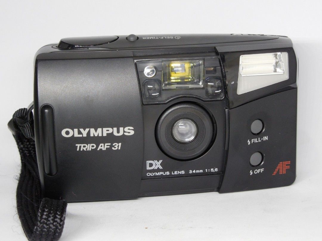 Olympus Trip AF31 (Category: Cameras) located in Las Pinas. Submitted by film101 (Listing ID 1282548415, Image 2). Description: Olympus trip AF 31 *mint condition with pouch -One of the beginner pns film camera -it's a slack and Go camera -run by AA battery 2 pcs not incl -Flash can do manually Condition of camera Electronic condition + Shutter working Flash working Timer working Film counter working AF working Shutter working Aperture snaps AF w