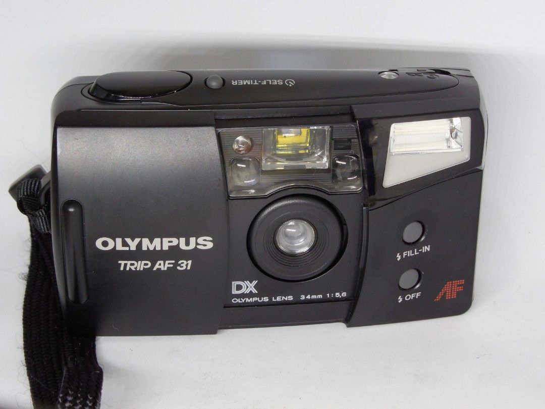 Olympus Trip AF31 (Category: Cameras) located in Las Pinas. Submitted by film101 (Listing ID 1282548415, Image 3). Description: Olympus trip AF 31 *mint condition with pouch -One of the beginner pns film camera -it's a slack and Go camera -run by AA battery 2 pcs not incl -Flash can do manually Condition of camera Electronic condition + Shutter working Flash working Timer working Film counter working AF working Shutter working Aperture snaps AF w