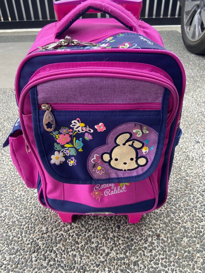 Robby Rabbit Trolly Bag (pink/purple) (Category: Babies & Kids Fashion) located in Las Pinas. Submitted by gepoy303 (Listing ID 1282424544, Image 1). Description: Robby Rabbit Trolly Bag - 12in (L) x 14in (W) x 7in (H, not yet expanded) - with side pocket, water tumbler pocket - cleaned, 8/10 condition - can be used for nursery to Grade 1, fits books and notebook Location: las pinas / BGC Thank you. .