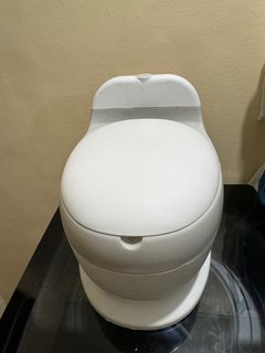 Toddler potty trainer; toilet bowl with sounds