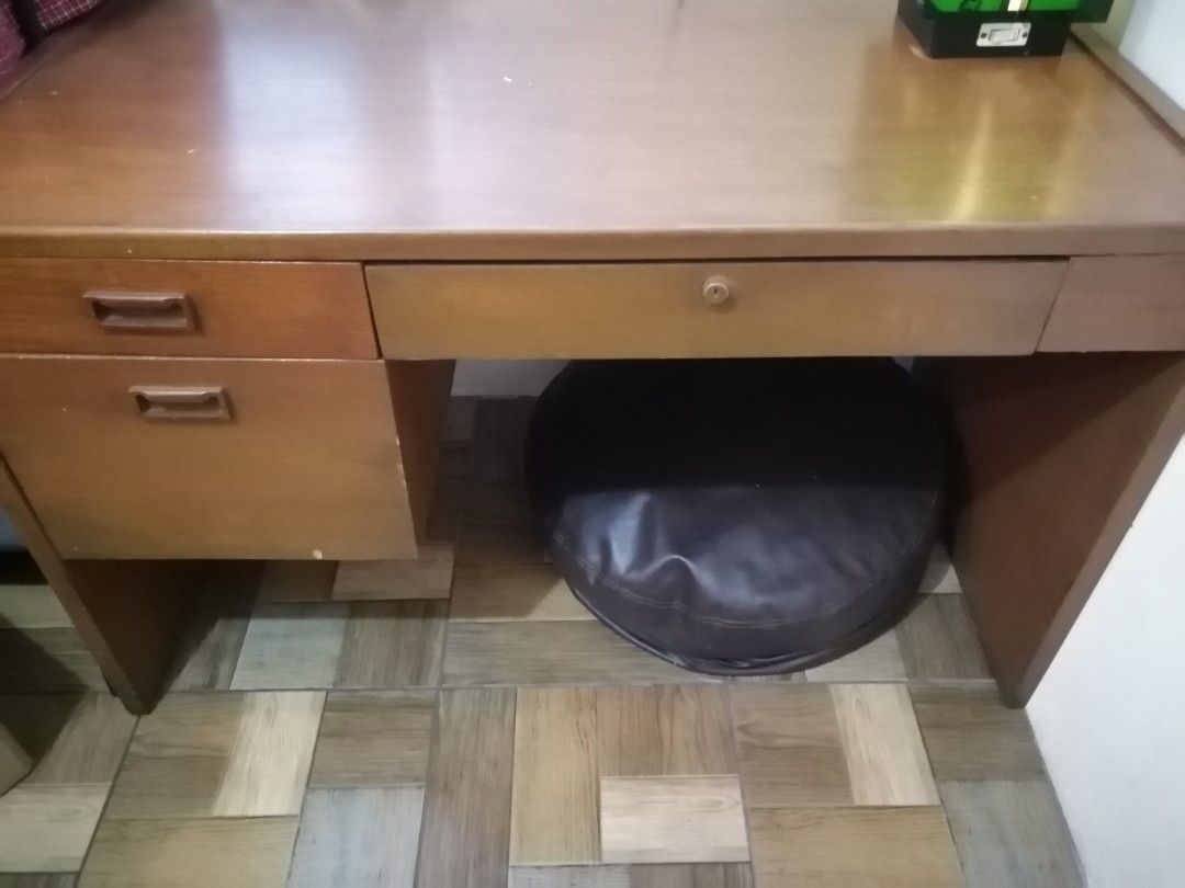Wooden Study Table (Category: Tables & Sets) located in Taytay. Submitted by ochandmedown (Listing ID 1282623767, Image 2). Description: Wooden Study Table With 3 drawers Minor signs of usage (see attached photos) No other issues Kayang irevarnish or wood stain Approxinate measurement 4ft L x 2ft W x 2.5ft H.