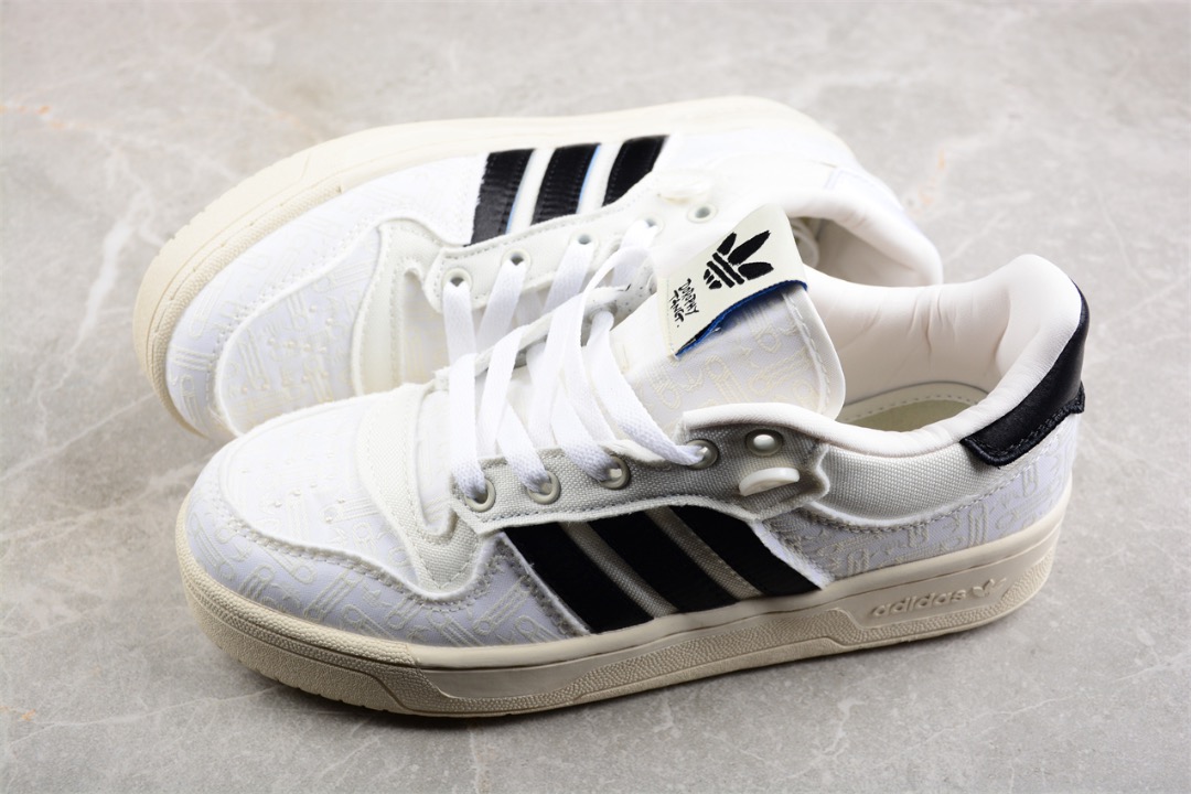 White and black discount adidas tennis shoes