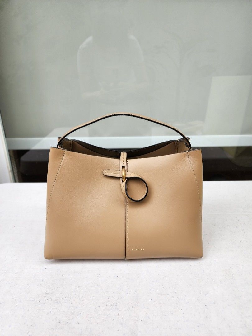 AUTH WANDLER AVA BAG SMALL (Category: Luxury Bags & Wallets) located in Muntinlupa City. Submitted by trishdlf (Listing ID 1282994007, Image 2). Description: Auth Wandler Ava Bag size Small Like New Condition 10/10 Size: 7" H X 10" L x 6" depth Purchased in Adora about 2 years ago for 49.8k (see tag) Carried less than 10x Inclusions: Dustbag, strap, cards, Adora paper bag RFS: decluttering MOP: BPI only Meet-ups: Alabang. For Pasig/Makati I requi