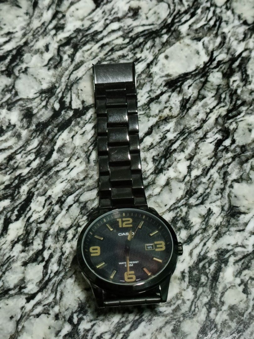 Casio black analog watch top