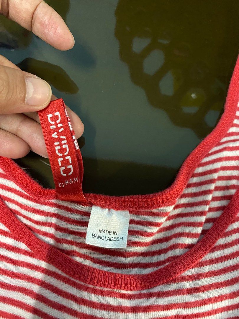 Divided by H&m sleeveless (Category: Sleeveless) located in Binan City. Submitted by casseyshoppe (Listing ID 1282820604, Image 2). Description: Im selling divided by h&m sleeveless for women Small-medium Stretchable Red and white Stripes In good condition Payment first thru gcash Shipping via j&t or lalamove at buyer’s expense.
