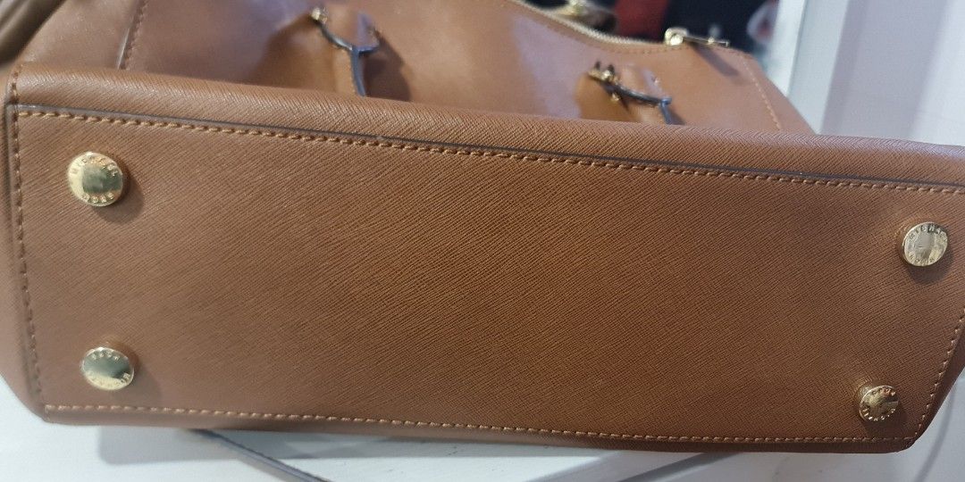 Real michael kors bag vs fake store