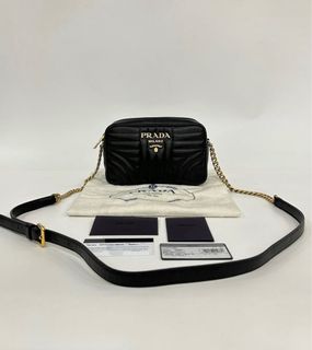 Prada nappa impunture discount diagramme sling bag