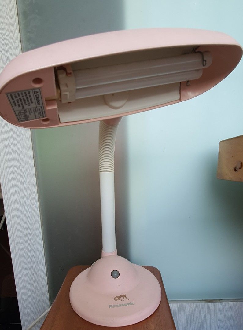 Table / Study Lamp (Category: Lighting) located in Singapore. Submitted by jaz_j (Listing ID 1282838323, Image 1). Description: Pink. Panasonic. Good working condition. Defect: patch where sticker was..