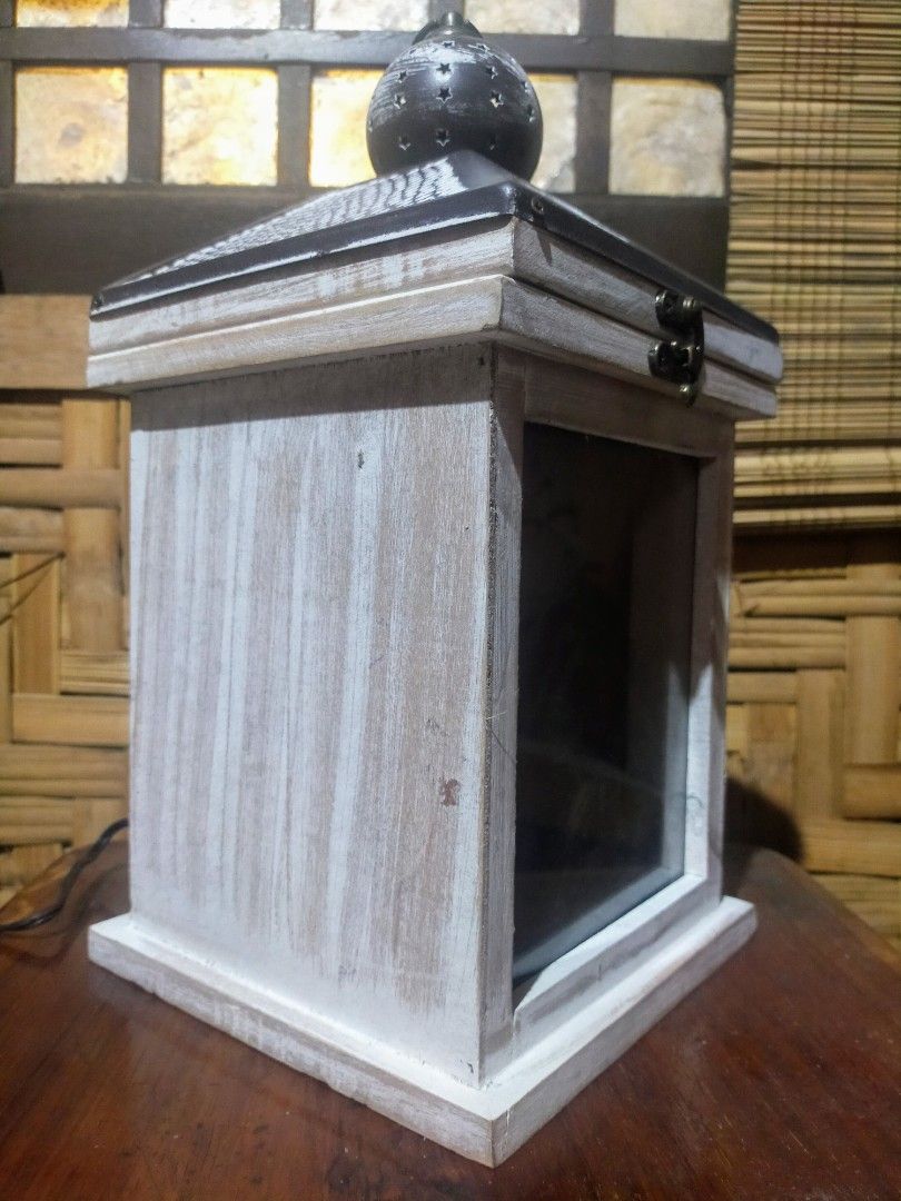 Hanging lamp (Category: Lighting) located in Quezon City. Submitted by dello5 (Listing ID 1283243513, Image 3). Description: Table/ Hanging Lamp -good condition -with 12volts power supply -can be hanged or in table top -7" x 7" base size -14" tall -wood & metal materials -light is moving like real fire -video can be requested if needed 950php Tandang Sora QC.