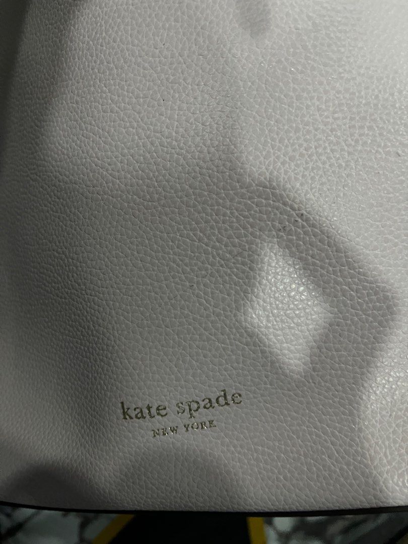 Katespade bucket bag (Category: Luxury Bags & Wallets) located in Makati City. Submitted by pochiiii (Listing ID 1283261305, Image 3). Description: Bought for 9k has flaw on the handle due to storage.