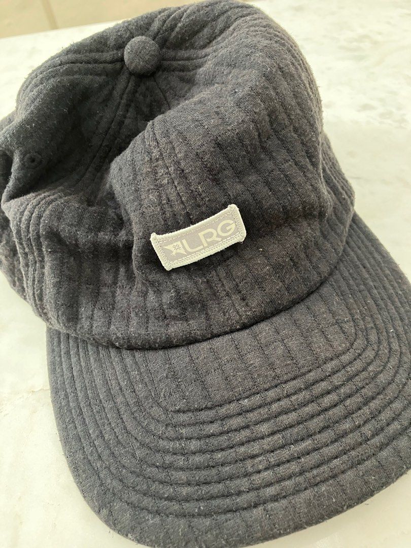 LRG black fabric cap (Category: Caps & Hats) located in Manila. Submitted by zolnak (Listing ID 1283366422, Image 1). Description: Good condition. Holland brand. Reflective front brand patch. Adjustable leather back strap with metal clasp. Buyer to shoulder shipping. .