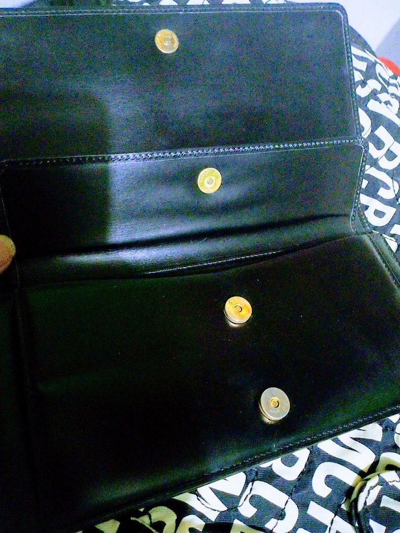 Nina Ricci long leather wallet (Category: Luxury Bags & Wallets) located in Paranaque City. Submitted by maikeelicious (Listing ID 1283283290, Image 3). Description: Nina Ricci leather wallet.