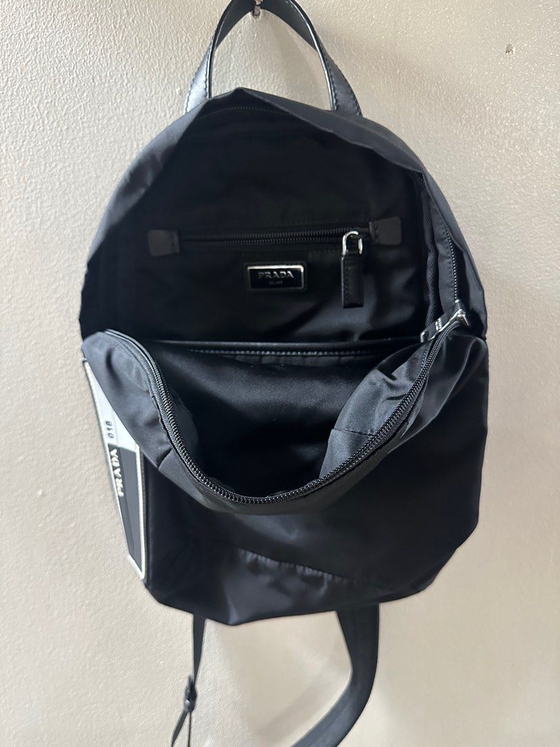Prada Nylon Crossbody Backpack (Category: Luxury Bags & Wallets) located in Pasig City. Submitted by grfld08 (Listing ID 1283308945, Image 3). Description: Prada Crossbody Backpack Color: Black Material: Nylon Condition: 9/10 Interior: 2 compartments and 1 zipped pocket Exterior: 1 zipped compartment Adjustable strap Strap hook can be switched between left and right for ideal comfort / style 100% Authentic.