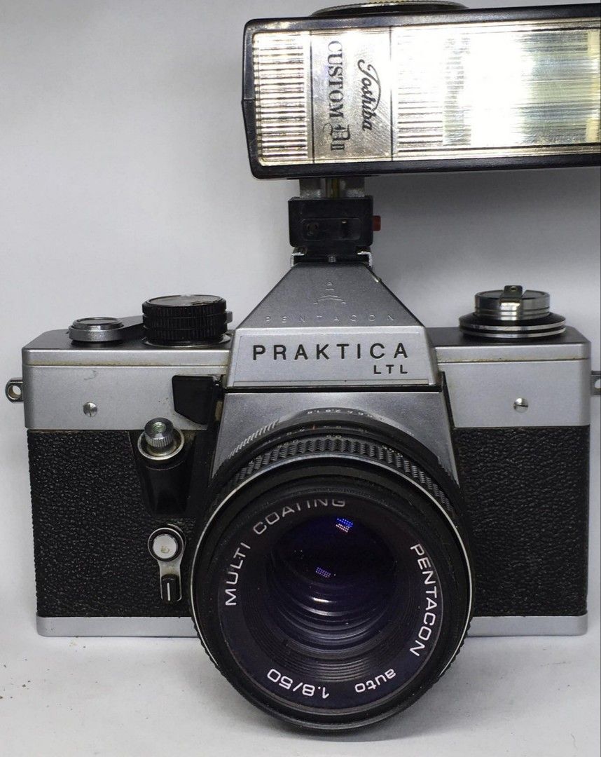 PRAKTICA LTL CAMERA GERMANY (Category: Cameras) located in Las Pinas. Submitted by film101 (Listing ID 1283218419, Image 1). Description: PRAKTICA LTL PENTACON MADE IN GERMANY *with broken TOSHIBA FLASH(not working! Ptsek nyo nalang) *with filter ring glass IT'S a mechanical camera with M42 mount *with pentacon lens multi coating 50mm F1.8 *made in GDR *meter untested! No worries it's mechanical shutter same like spotmatic Condition of camera Wor