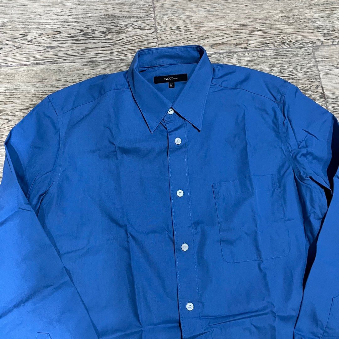 Cropped Blue Button Down Polo Shirt (Category: Formal Shirts) located in Quezon City. Submitted by lostboxph (Listing ID 1276559059, Image 2). Description: Length: 54cm Width: 47cm.