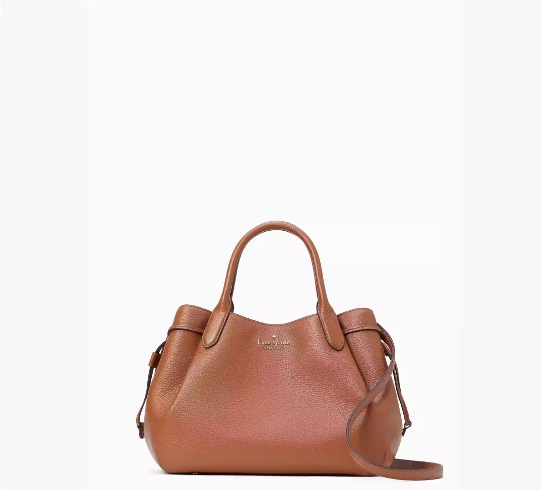 Kate Spade New York Dumpling Large Satchel (Category: Luxury Bags & Wallets) located in Manila. Submitted by chmegger (Listing ID 1276772444, Image 3). Description: • Bought from the US. • Price: PHP15,000 • Reason for Sale: Bought the wrong color. • Product Details: Measurements 12.8" W x 9.6" H x 6.4" D Strap Drop: 5.5" Handle Drop: 5.125" Features Strap Drop: 22" Metal Pinmount Logo Closure Type: magnetic snap closure with middle zip compartme