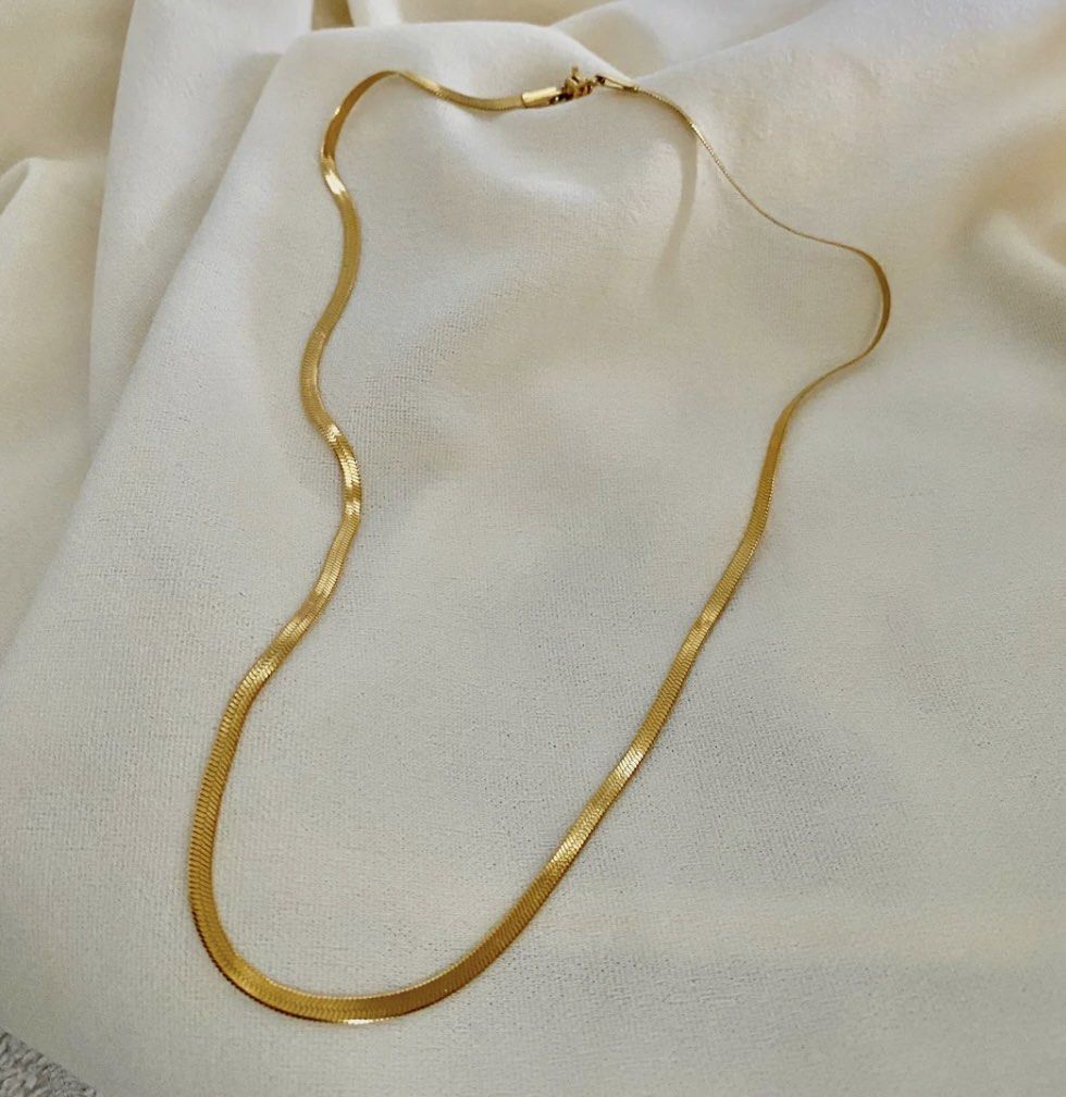MAZEE Jewelry Flat Snake Chain Necklace (Category: Necklaces) located in Rizal. Submitted by samviz (Listing ID 1276628809, Image 2). Description: MAZEE Jewelry Flat Snak Chain 18 inches Gold plated stainless steel Approx 8g Approx 4 mm (thickness) fixed until 18 inches Includes velvet pouch Selling for less than its original price Buyer to arrange and shoulder courier fee RFS: Was gifted an identical item.