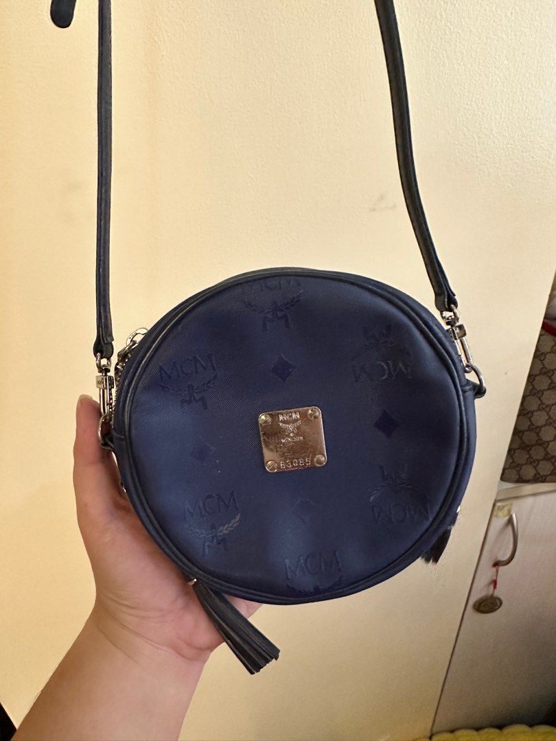MCM 2-way micro bag (Category: Luxury Bags & Wallets) located in Quezon City. Submitted by angshopper (Listing ID 1276563628, Image 1). Description: -can be used as sling, crossbody or belt bag -with scratches on the hardware -can fit keys, lipstick and other essentials (not phone) -5.2 x 5.2 x 1.4 inches, 50” strap length (25” drop) .