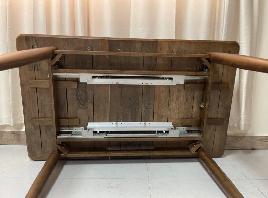 Extendable Wood Table 4-8 Seater living and dining. (Category: Tables & Sets) located in Guiguinto. Submitted by misay16 (Listing ID 1276870947, Image 3). Description: Extendable Wood Table living and dining Table solid wood. A Mid-Century Modern extendable dining table with E2 MDF table and veneer finish table top with solid black. detail and solid rubberwood legs. -Assembly Required - Available sizes: 110×80cm and 74cm height Extendable to 140x