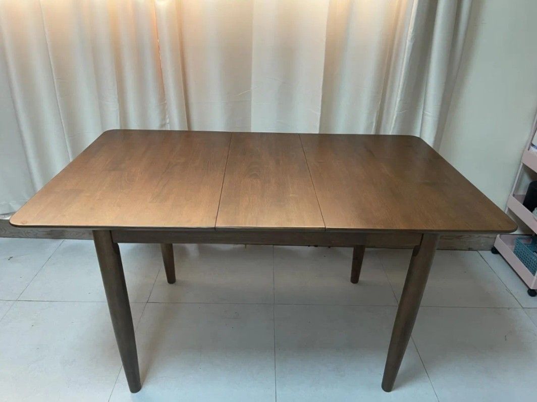 Extendable Wood Table 4-8 Seater living and dining. (Category: Tables & Sets) located in Guiguinto. Submitted by misay16 (Listing ID 1276870947, Image 1). Description: Extendable Wood Table living and dining Table solid wood. A Mid-Century Modern extendable dining table with E2 MDF table and veneer finish table top with solid black. detail and solid rubberwood legs. -Assembly Required - Available sizes: 110×80cm and 74cm height Extendable to 140x