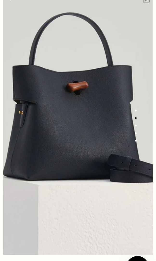 Looks Like Summer Gaia Bag Black (Category: Cross-body Bags) located in Pasig City. Submitted by crnuque (Listing ID 1276944885, Image 2). Description: Bought from Looks Like Summer website for 145USD. Used twice. RFS: the shape isn't for me. Indulge in the luxurious elegance of the Gaia Tote Bag - a true testament to exquisite craftsmanship and timeless appeal. With its blend of natural inspiration and refined design, this handbag is destined to