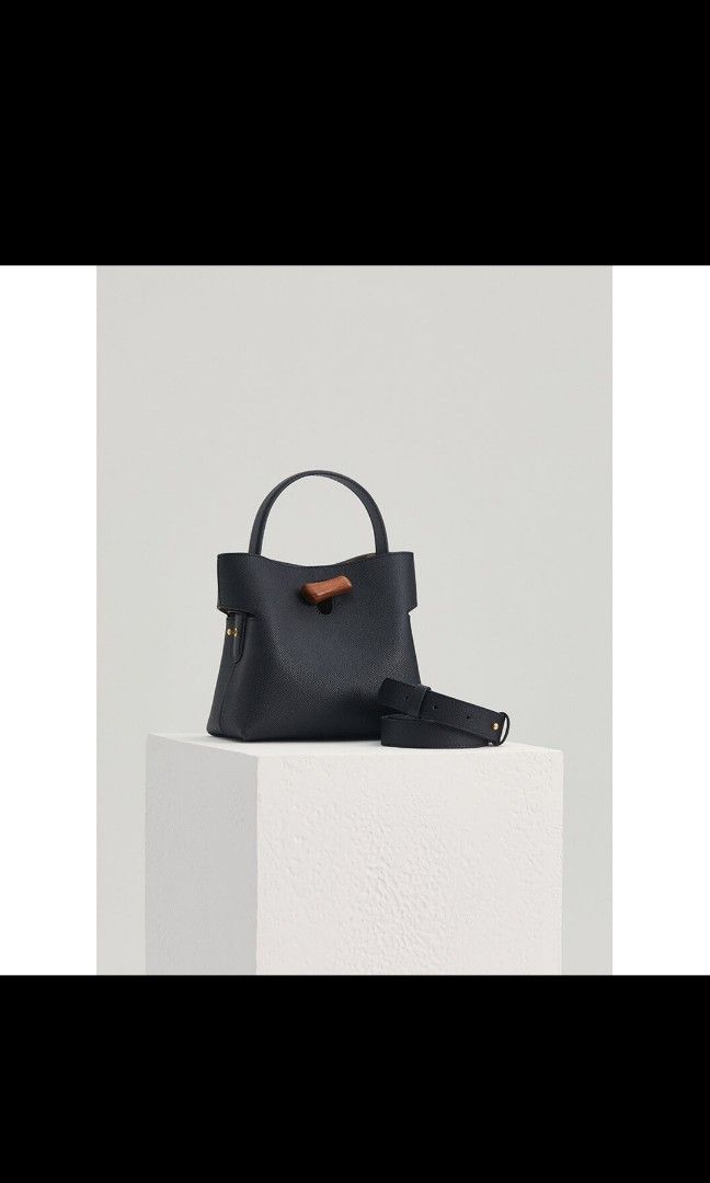 Looks Like Summer Gaia Bag Black (Category: Cross-body Bags) located in Pasig City. Submitted by crnuque (Listing ID 1276944885, Image 1). Description: Bought from Looks Like Summer website for 145USD. Used twice. RFS: the shape isn't for me. Indulge in the luxurious elegance of the Gaia Tote Bag - a true testament to exquisite craftsmanship and timeless appeal. With its blend of natural inspiration and refined design, this handbag is destined to
