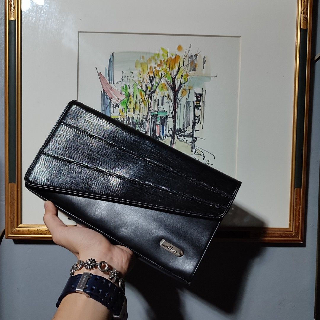 Versace Clutch/pouch bag (Category: Luxury Bags & Wallets) located in Taytay. Submitted by highendmnl (Listing ID 1276918528, Image 1). Description: Versace Clutch Bag 11" x 6" size dimension Unisex excellent used condition.
