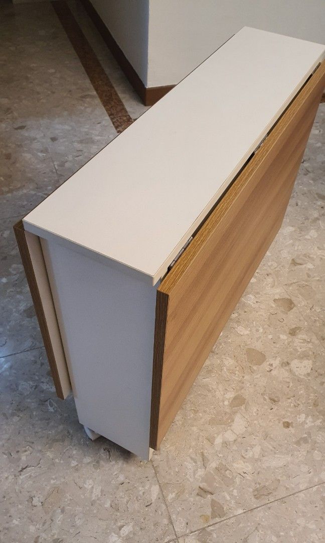 Extendable table (Category: Tables & Sets) located in Singapore. Submitted by 9preciousmoments9 (Listing ID 1277237264, Image 2). Description: Extendable table Both side extend, length is 120cm Either one side extend, length is 70cm Without extending, length is 25cm As-is condition Please arrange your own transport.