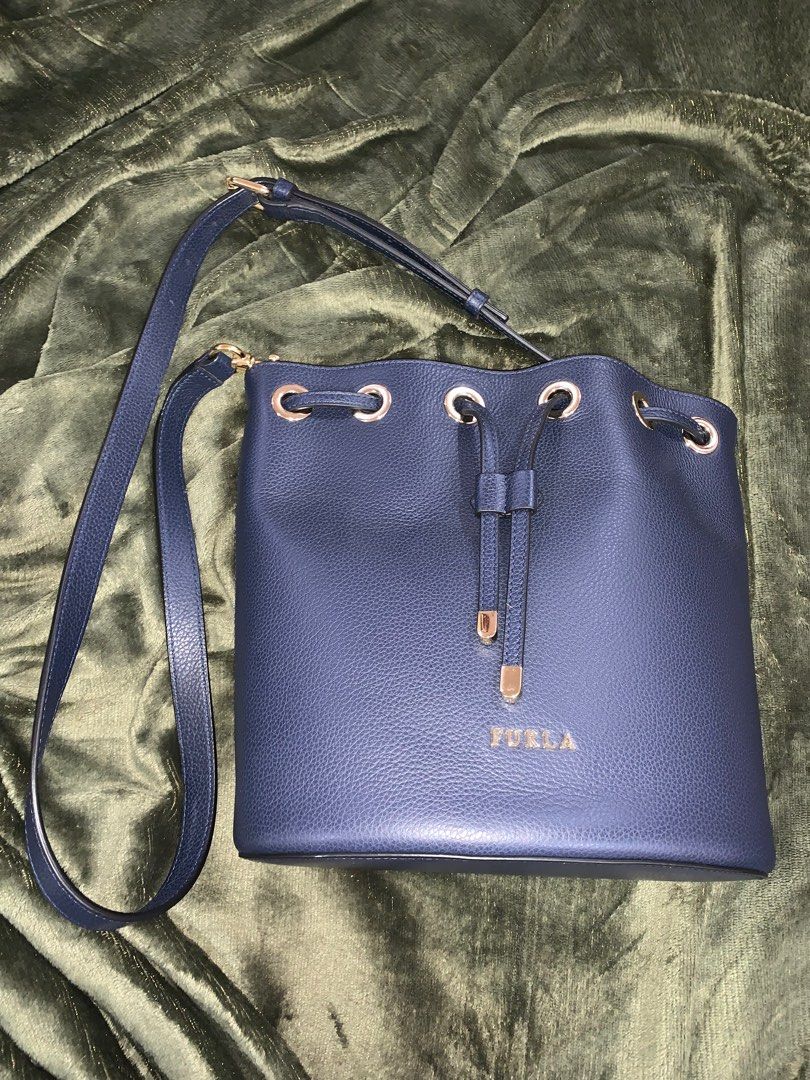 Furla Bucket Bag (navy blue) (Category: Luxury Bags & Wallets) located in Quezon City. Submitted by shop.sola (Listing ID 1277272270, Image 2). Description: Barley used furla bucket bag.