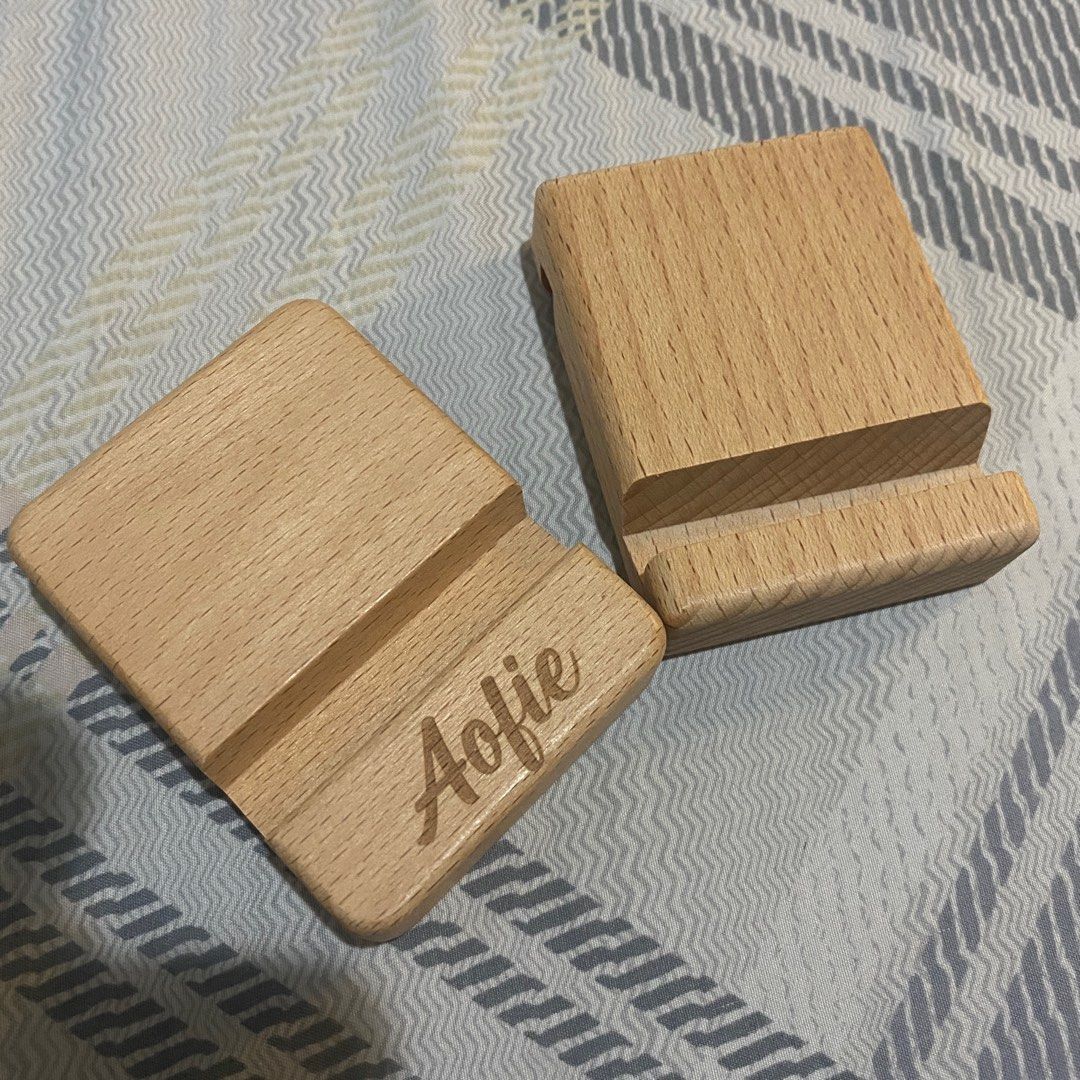 personalized wooden phone/ipad stand available for bulk (Category: Mounts & Holders) located in Las Pinas. Submitted by azzyplane (Listing ID 1277217633, Image 1). Description: personalized stable wooden phone/ipad stands. perfect for studying, note taking, watching videos and etc :) Only for bulk personalized orders! (>18) perfect for giveaways, gifts, debuts and etc. plain/no personalized text - 50 pesos with personalized text - 75 pesos.