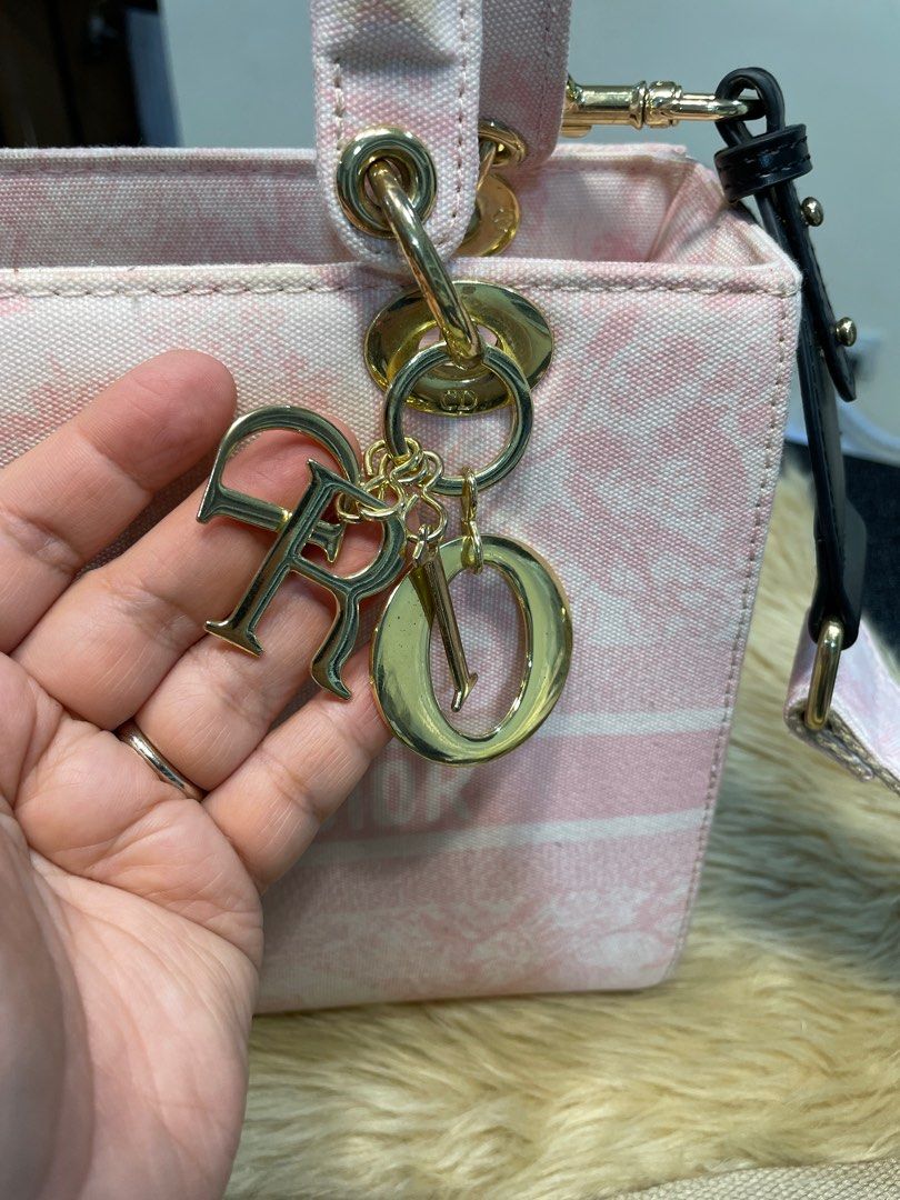 Preloved Lady Dior Sling (Category: Luxury Bags & Wallets) located in Bacoor. Submitted by themlrbagshop2.0 (Listing ID 1277163004, Image 2). Description: Preloved Lady Dior Canvas Bag ✅PM FOR THE PRICE 25cm Intact Canvas Minor Flaw: Stains on the handles due to storage but will provide twillies. ☺️ with sling Disclaimer: Themlrbagshop 2.0 is not associated or affiliated with any brands mentioned. All copyrights reserved to the rightful original 