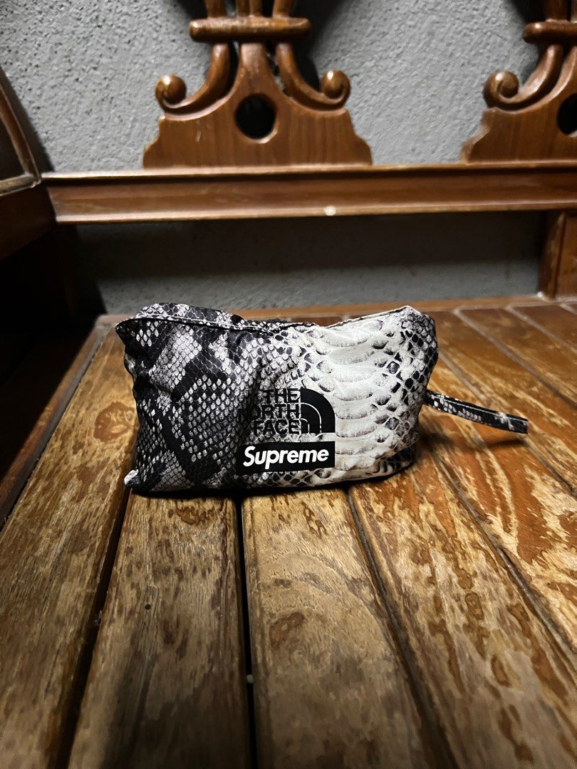 Supreme north face discount snakeskin duffle bag